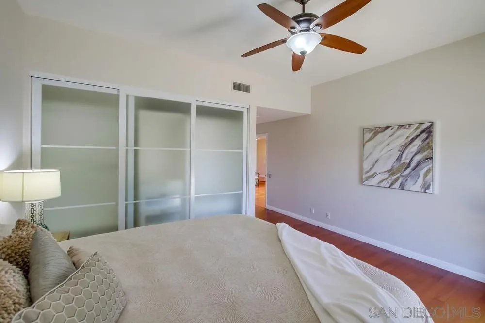 14747 Dash Way Poway, CA 92064 - Photo 21 of 65 a bedroom with a bed and a lamp