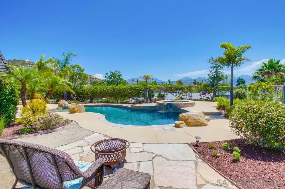 14747 Dash Way Poway, CA 92064 - Photo 36 of 65 a view of a lake with couches with wooden floor and city view
