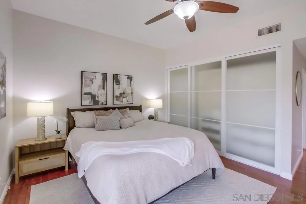 14747 Dash Way Poway, CA 92064 - Photo 48 of 65 a bedroom with a bed and a lamp