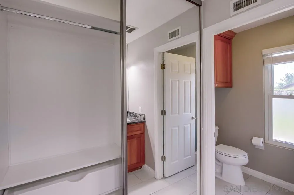 14747 Dash Way Poway, CA 92064 - Photo 50 of 65 a bathroom with a shower and a toilet