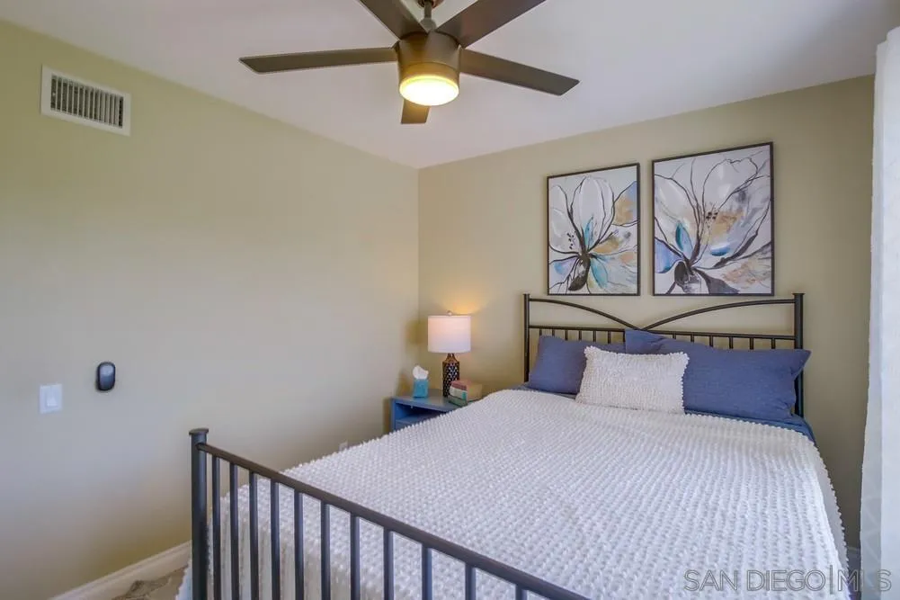 14747 Dash Way Poway, CA 92064 - Photo 56 of 65 a bedroom with a bed and a painting on the wall