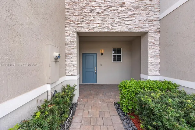 a view of a pathway both side of house