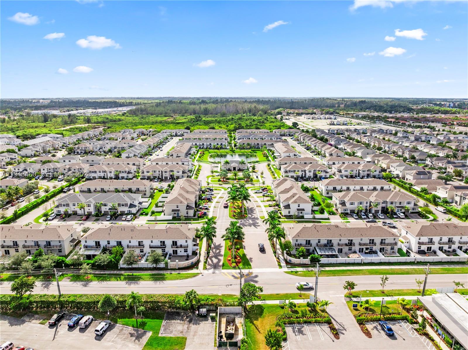818 Southeast 17 Street, Unit 818 Homestead, FL 33034 - Photo 30 of 36 an aerial view of a city with lawn chairs
