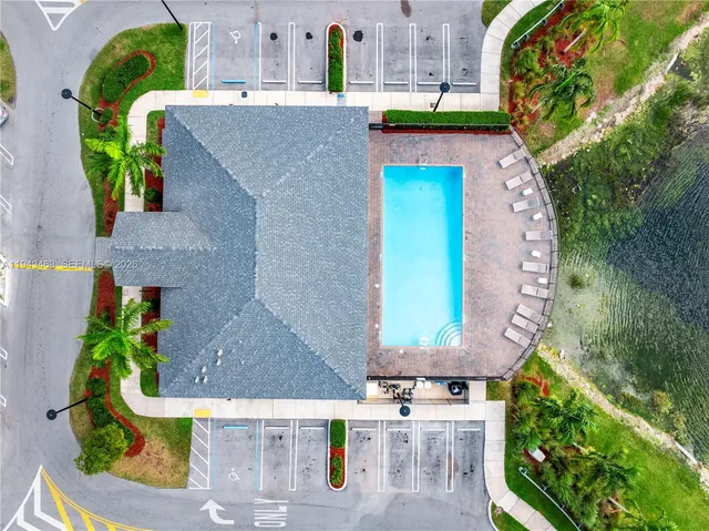 an aerial view of a house with a garden