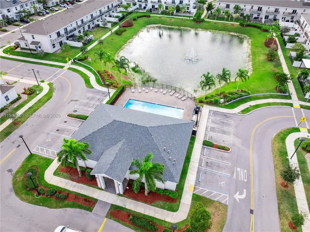 an aerial view of a house with a lake view