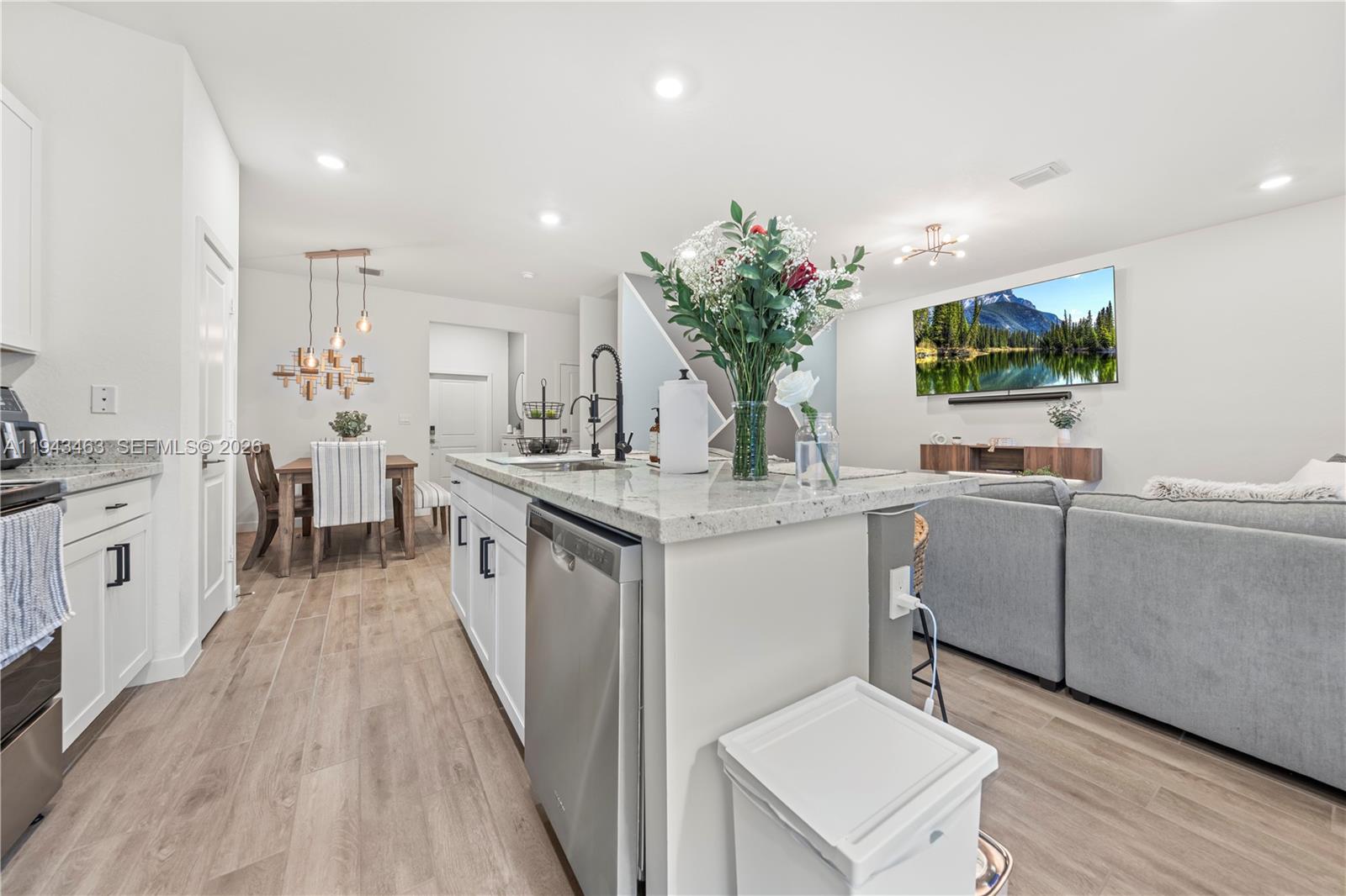 818 Southeast 17 Street, Unit 818 Homestead, FL 33034 - Photo 4 of 36 a kitchen with white cabinets and sink