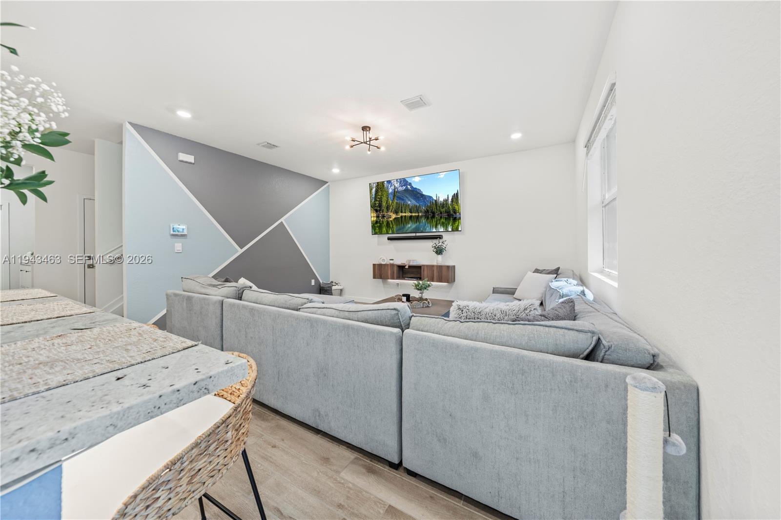 818 Southeast 17 Street, Unit 818 Homestead, FL 33034 - Photo 5 of 36 a living room with furniture and a flat screen tv