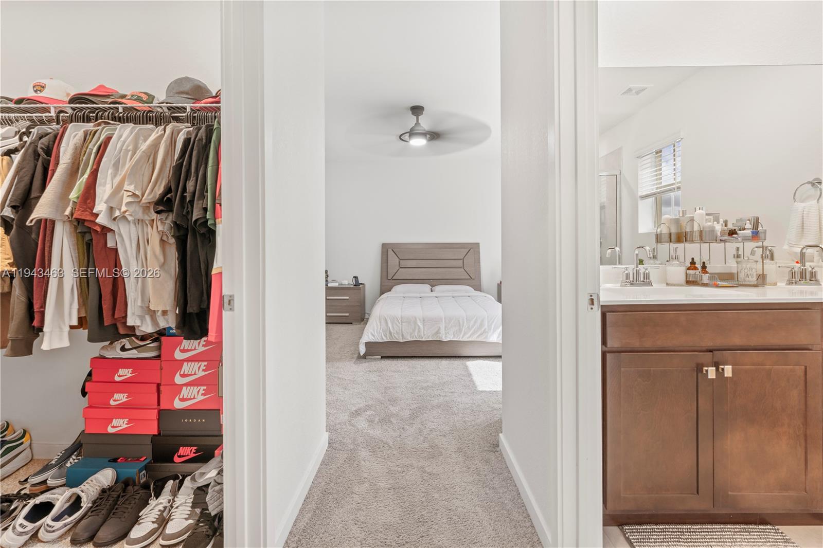 818 Southeast 17 Street, Unit 818 Homestead, FL 33034 - Photo 10 of 36 a en suite bathroom with a sink mirror and vanity