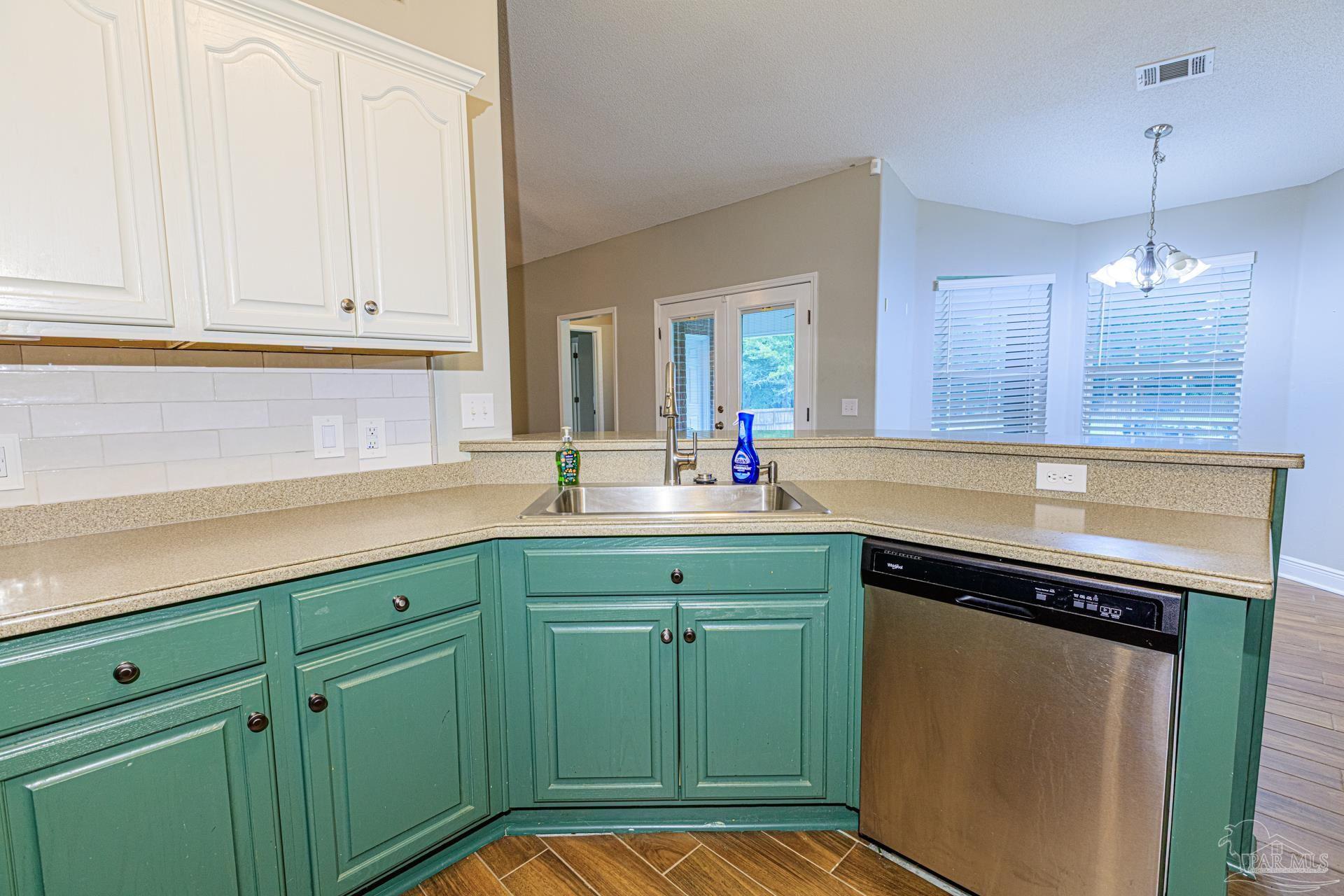 2863 Wallace Lake Road Pace, FL 32571 - Photo 11 of 44 a kitchen with cabinets and appliances