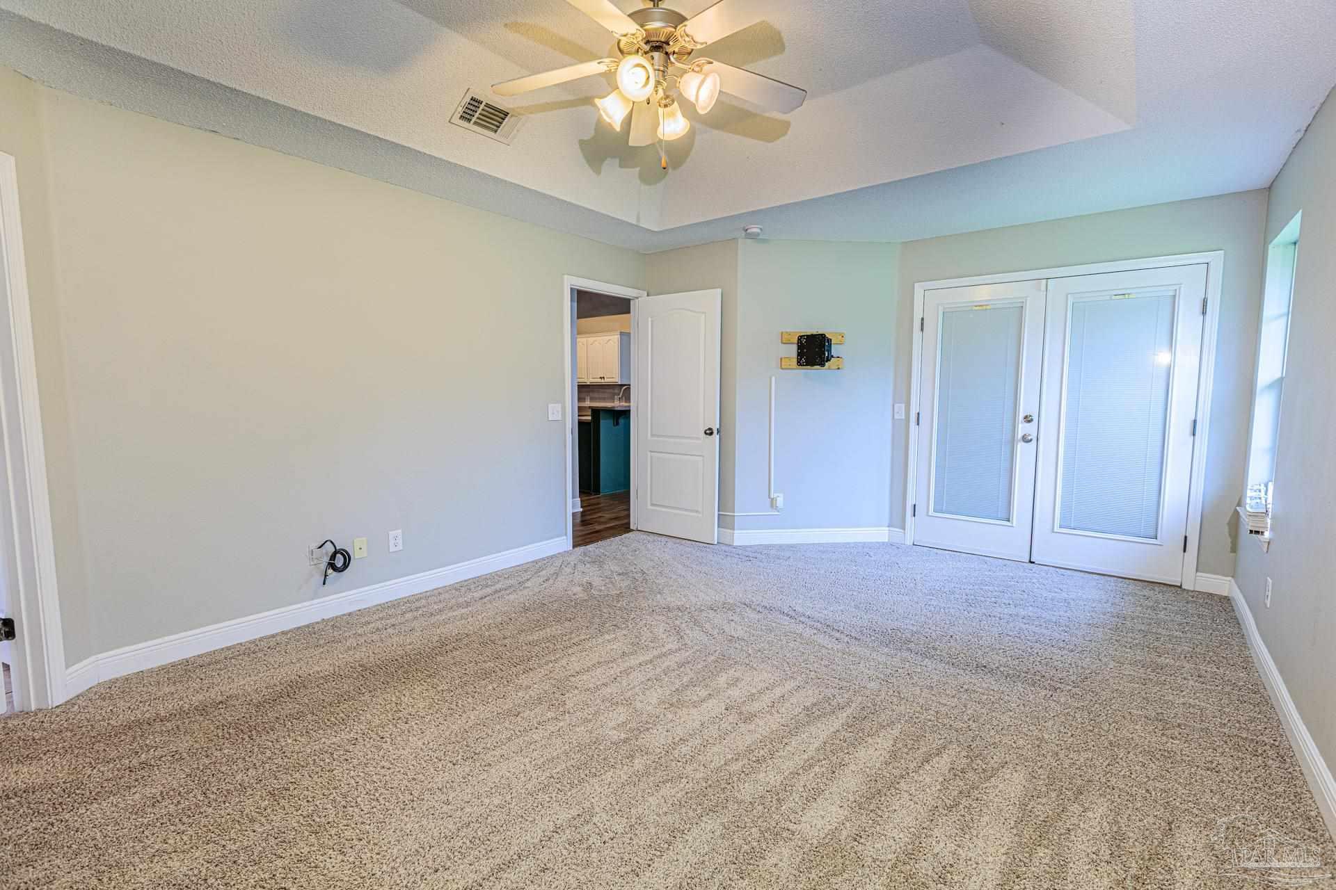 2863 Wallace Lake Road Pace, FL 32571 - Photo 14 of 44 a view of an empty room with a window