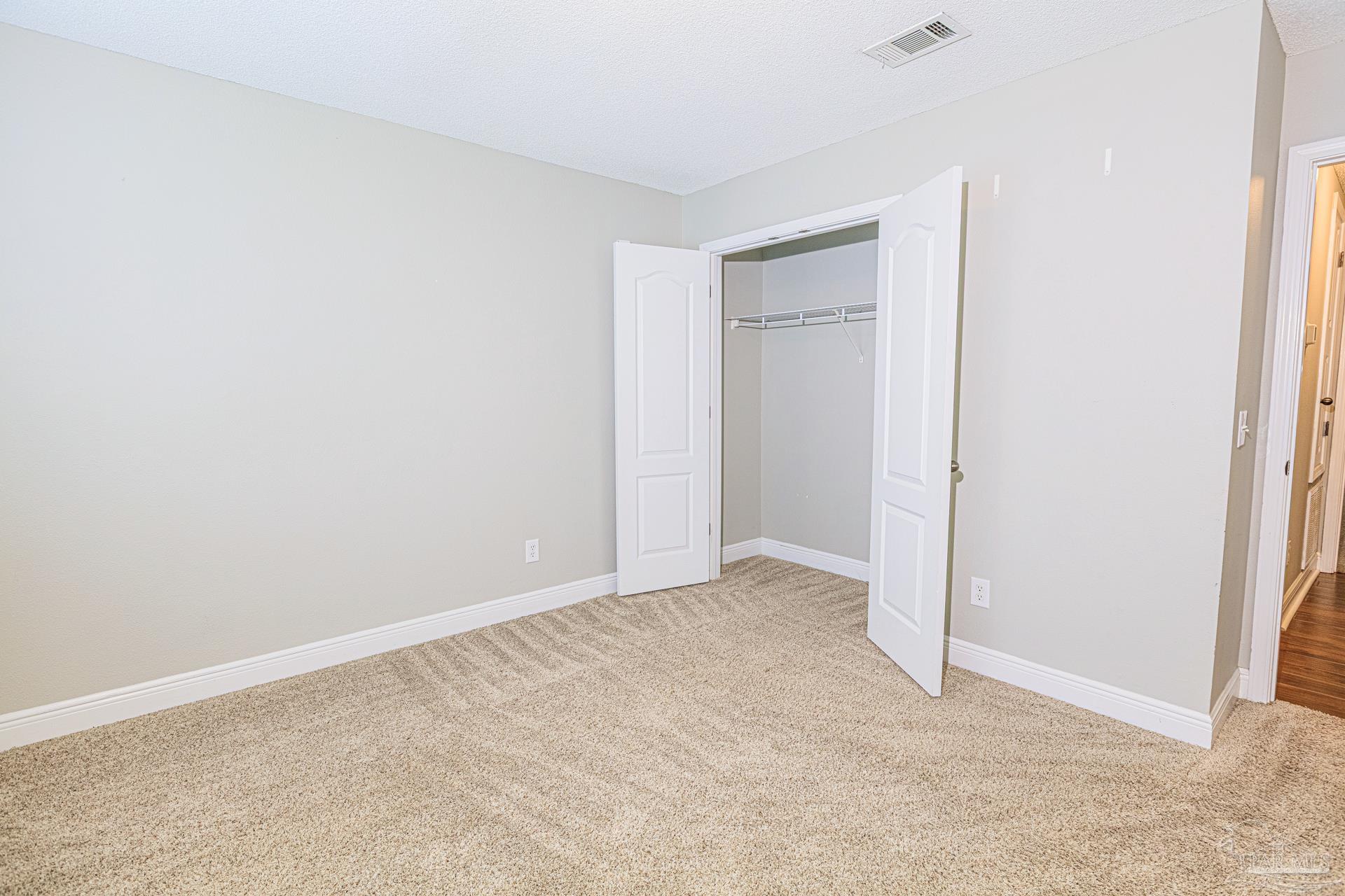 2863 Wallace Lake Road Pace, FL 32571 - Photo 19 of 44 a view of an empty room