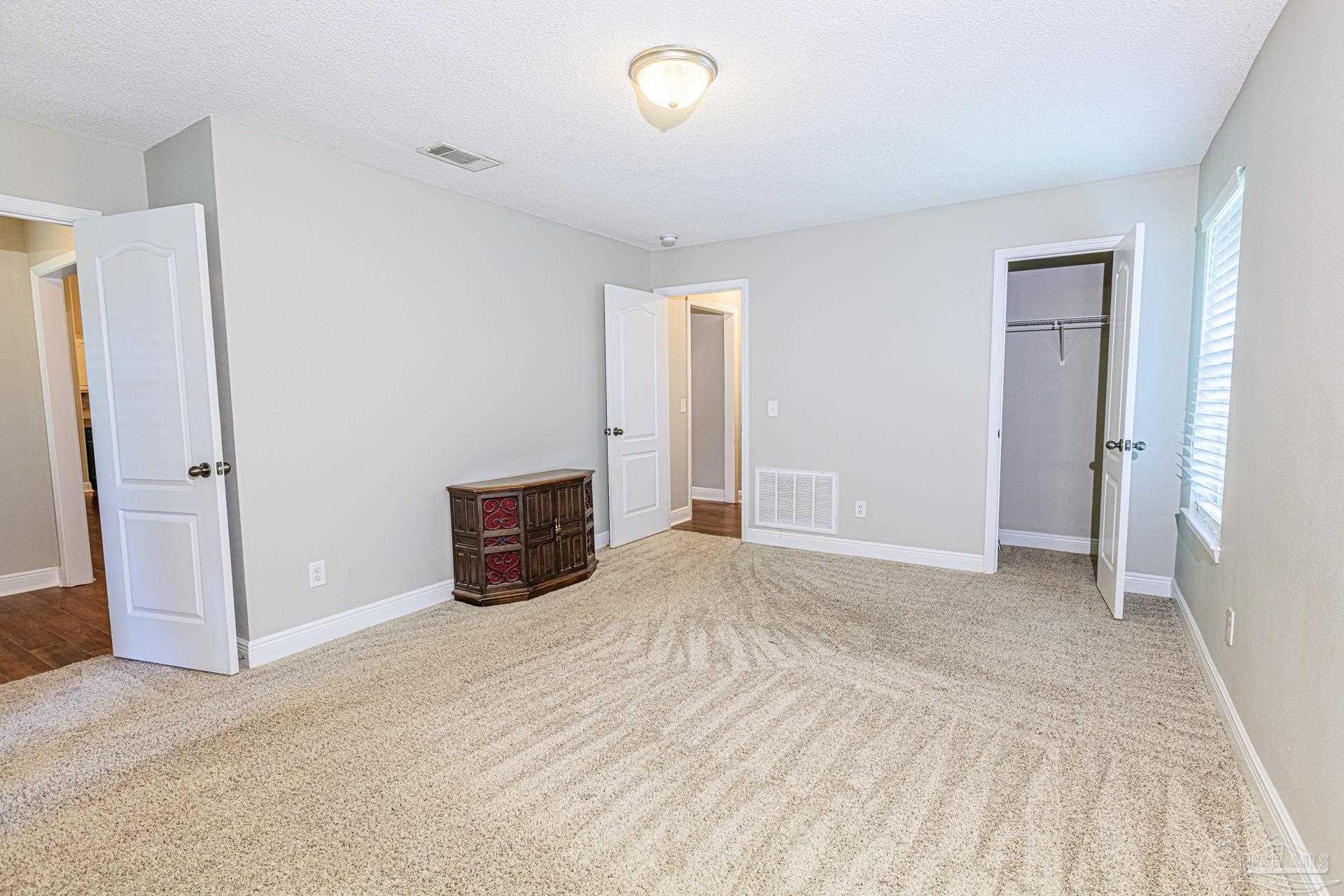 2863 Wallace Lake Road Pace, FL 32571 - Photo 24 of 44 a view of empty room with wooden floor