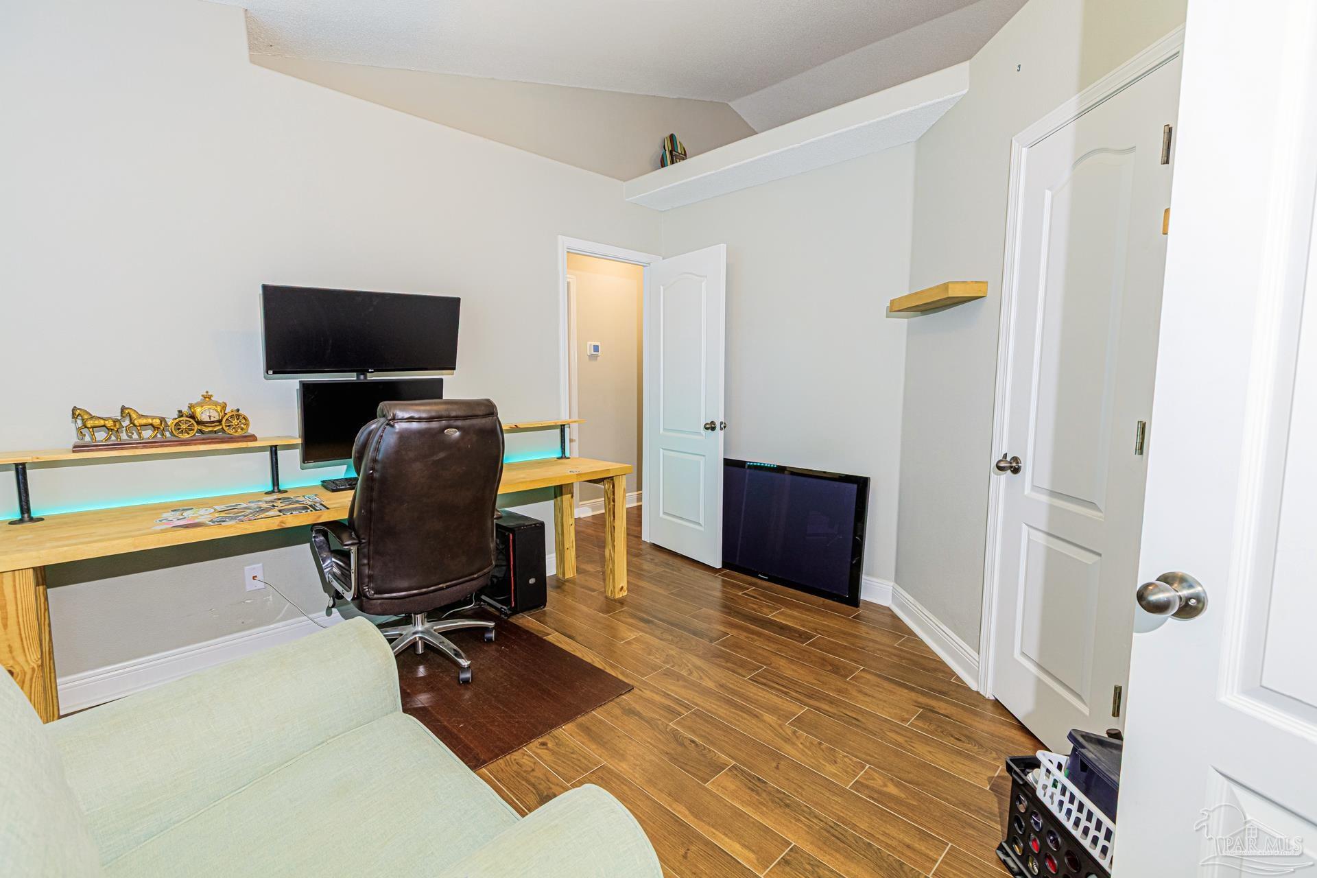 2863 Wallace Lake Road Pace, FL 32571 - Photo 28 of 44 a bedroom with a workspace