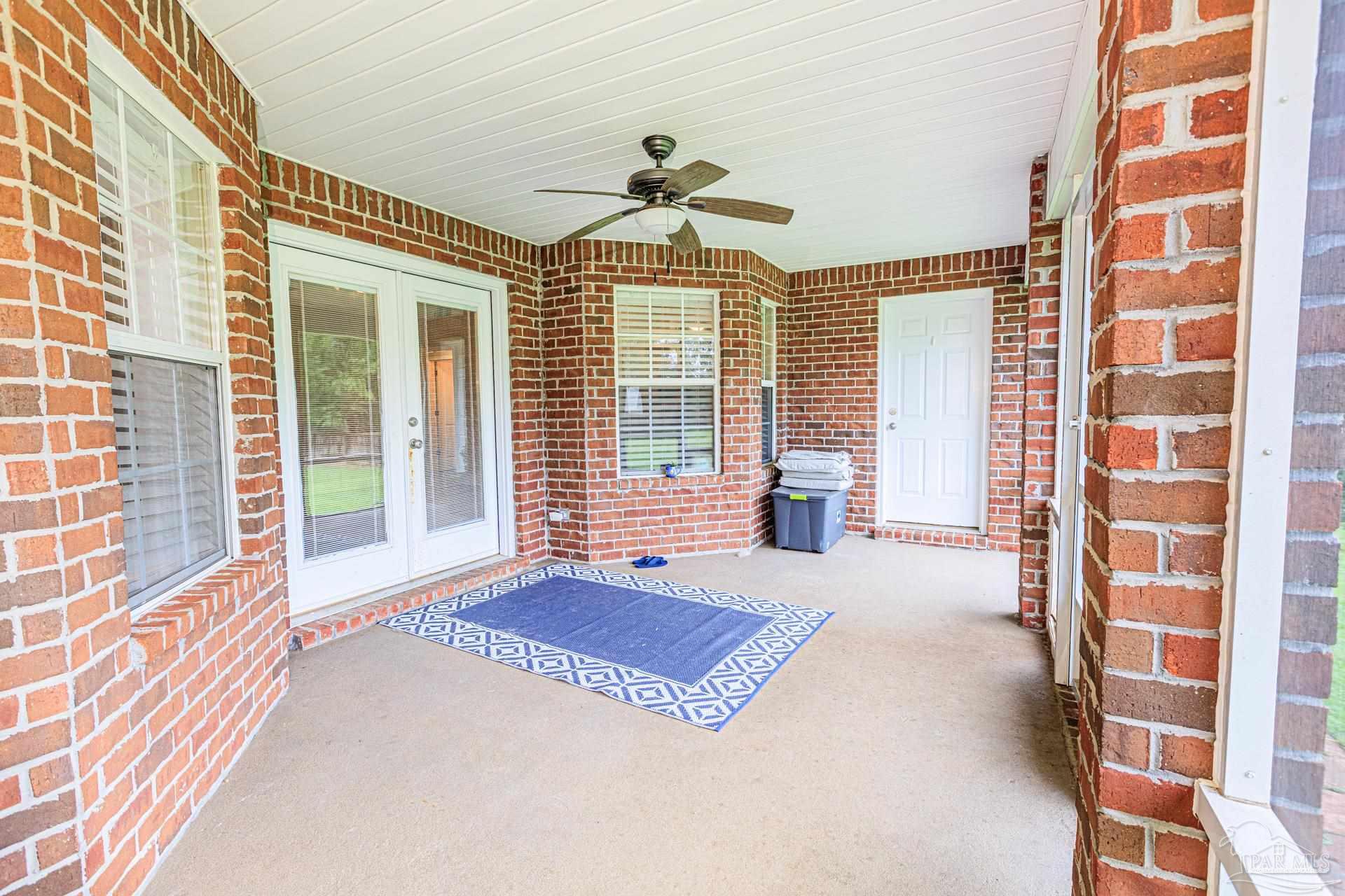 2863 Wallace Lake Road Pace, FL 32571 - Photo 29 of 44 a living room filled with furniture and a large window