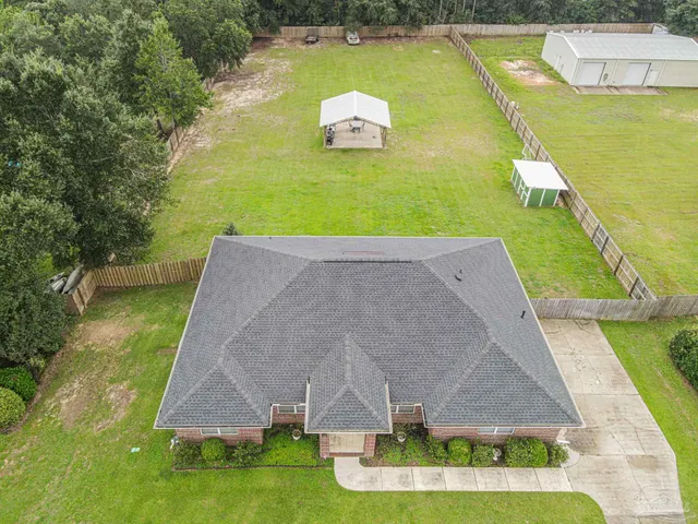 a aerial view of a house with swimming pool