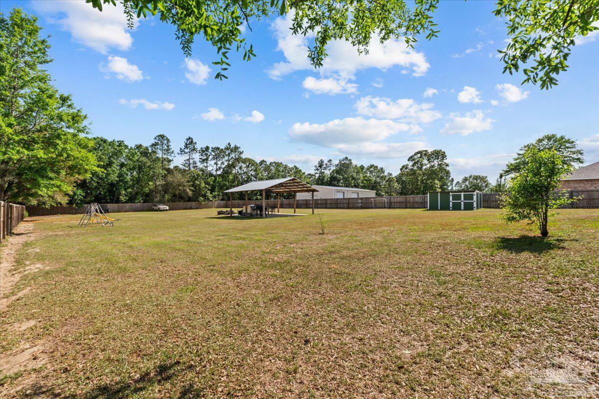 2863 Wallace Lake Road Pace, FL 32571 - Photo 40 of 44 a view of a yard with a tree