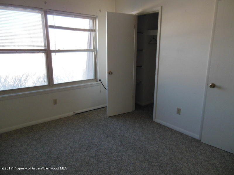 1393 West 2nd Street Craig, CO 81625 - Photo 11 of 16 an empty room with a window