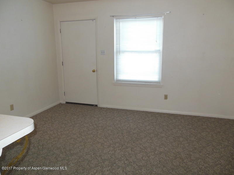 1393 West 2nd Street Craig, CO 81625 - Photo 15 of 16 an empty room with a window
