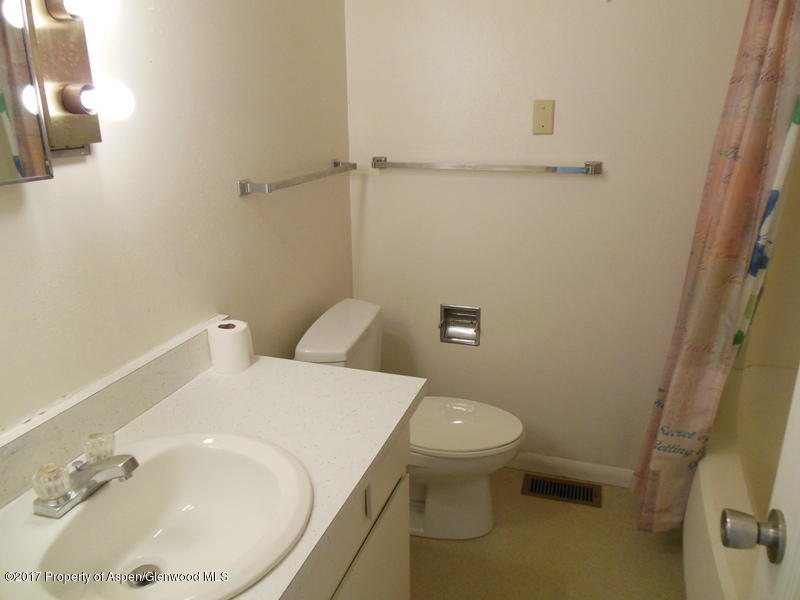 1393 West 2nd Street Craig, CO 81625 - Photo 10 of 16 a bathroom with a sink and toilet