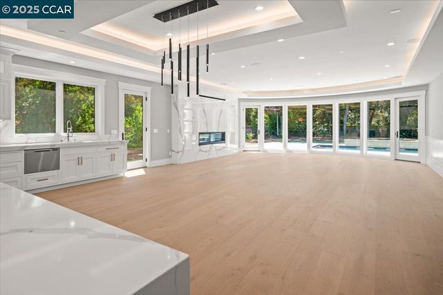 a view of a livingroom with wooden floor and window