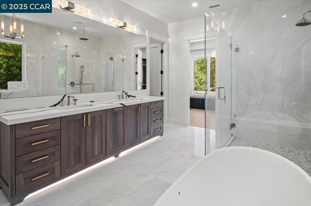 74 Middlefield Road Atherton, CA 94027 - Photo 23 of 51 a spacious bathroom with a tub sink shower and mirror
