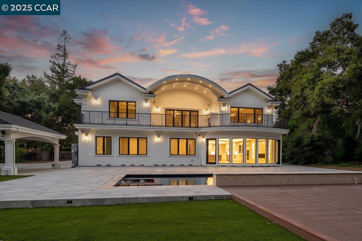 74 Middlefield Road Atherton, CA 94027 - Photo 3 of 51 a front view of a house with a yard