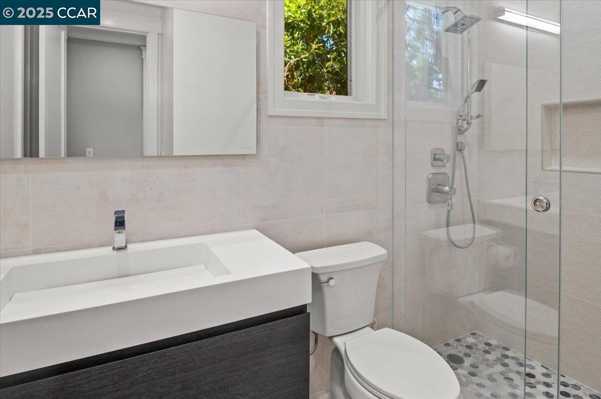 74 Middlefield Road Atherton, CA 94027 - Photo 37 of 51 a bathroom with a sink a toilet and shower