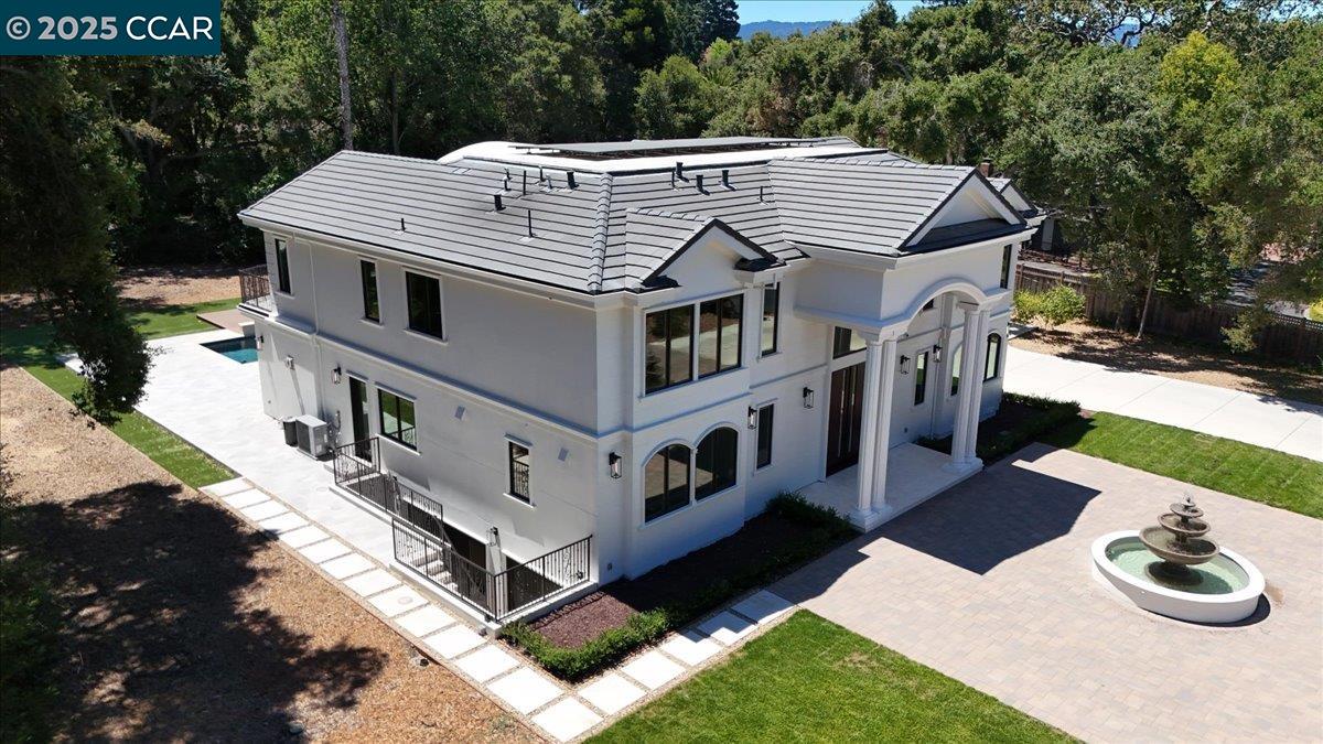 74 Middlefield Road Atherton, CA 94027 - Photo 4 of 51 a aerial view of a house with yard and sitting area