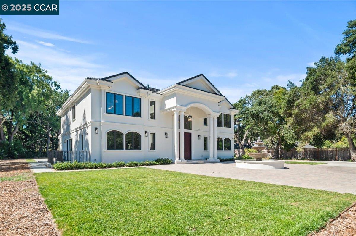 74 Middlefield Road Atherton, CA 94027 - Photo 45 of 51 a front view of a house with a yard