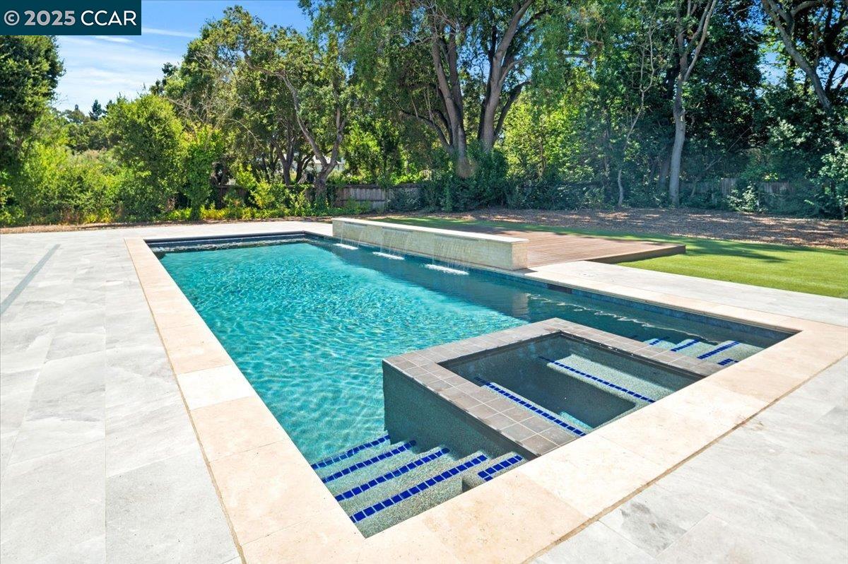 74 Middlefield Road Atherton, CA 94027 - Photo 5 of 51 a view of a swimming pool with a yard