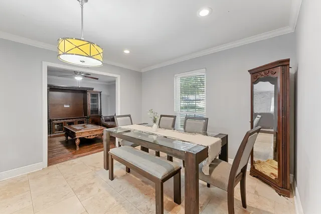 a view of a dining room with furniture window and outside view