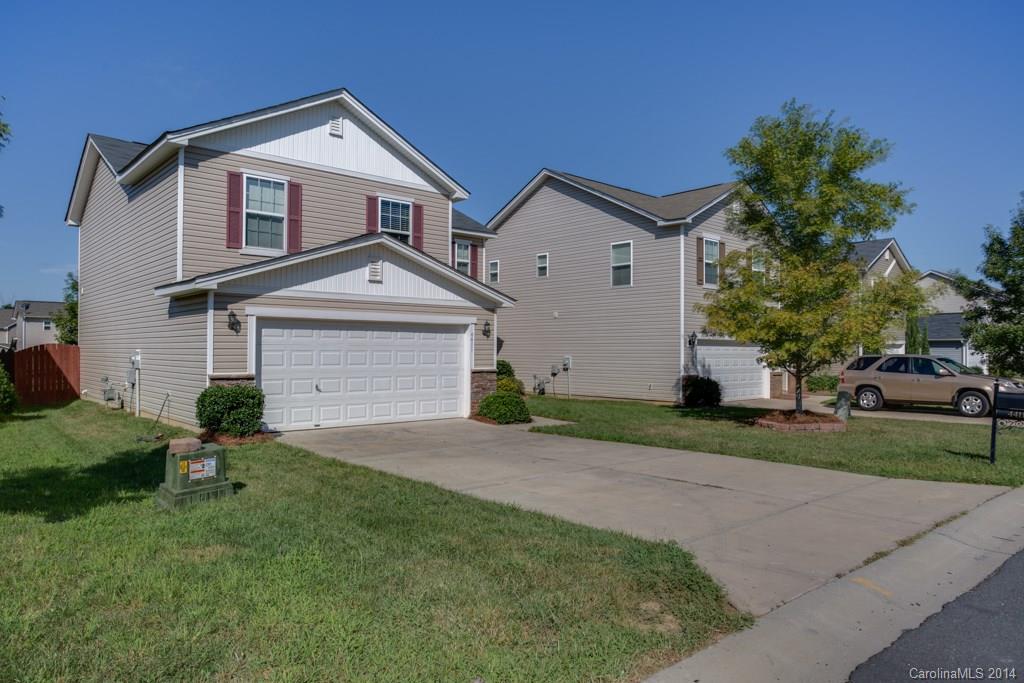 4411 Kiddle Lane Monroe, NC 28110 - Photo 2 of 24 a front view of a house with a yard and garage