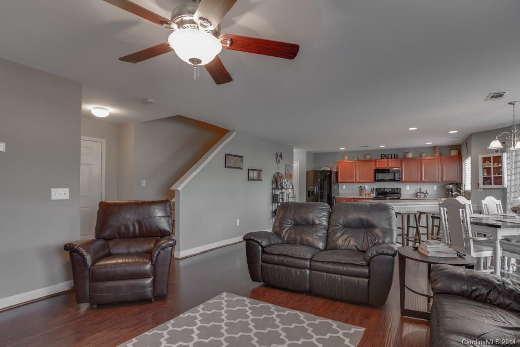4411 Kiddle Lane Monroe, NC 28110 - Photo 14 of 24 a living room with furniture and a ceiling fan