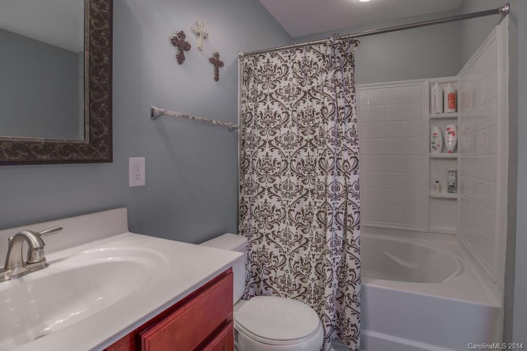 4411 Kiddle Lane Monroe, NC 28110 - Photo 23 of 24 a bathroom with a sink toilet and shower