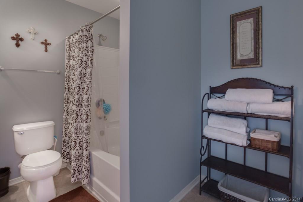 4411 Kiddle Lane Monroe, NC 28110 - Photo 24 of 24 a bathroom with a toilet a sink and bathtub