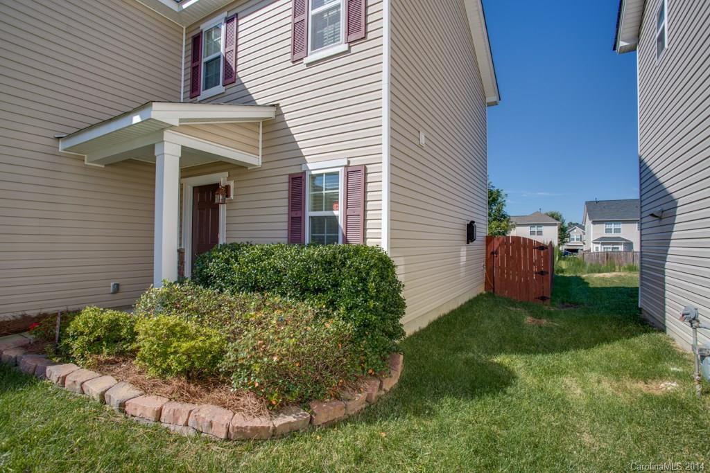 4411 Kiddle Lane Monroe, NC 28110 - Photo 5 of 24 a view of a house with a yard and sitting area