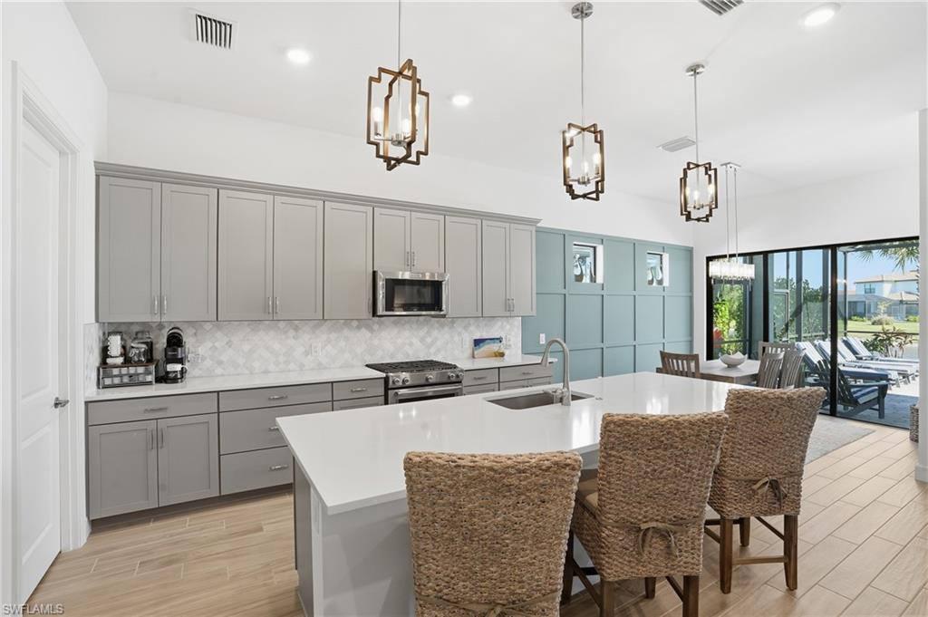 1872 Terreno Boulevard Naples, FL 34120 - Photo 11 of 50 a view of a dining room with furniture