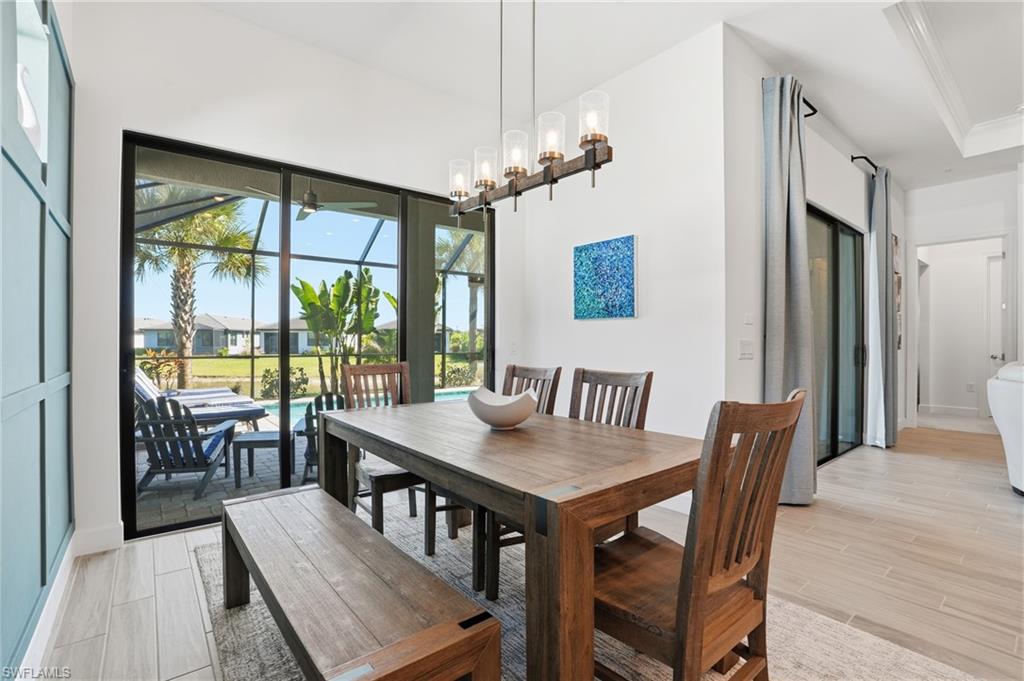 1872 Terreno Boulevard Naples, FL 34120 - Photo 16 of 50 a view of a dining room with furniture window and outside view