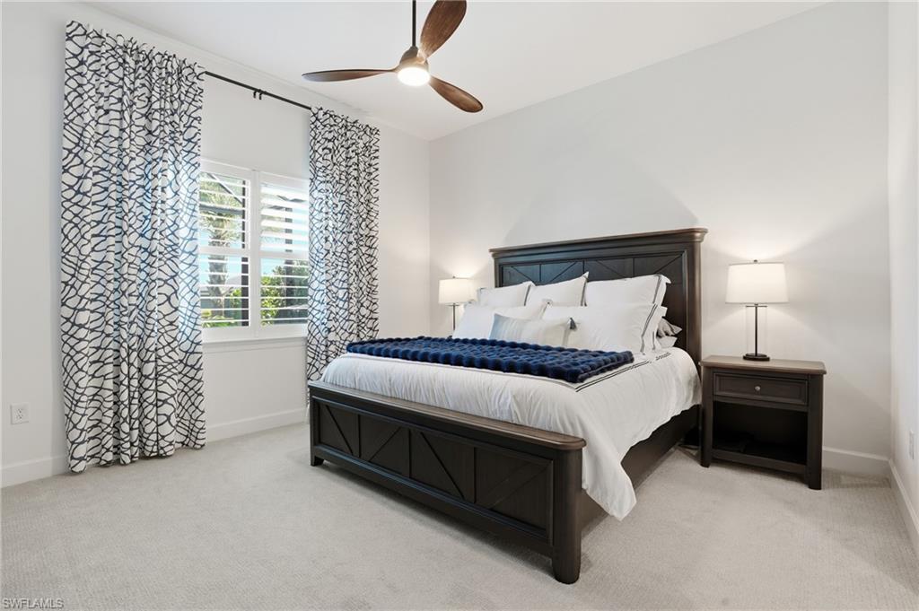 1872 Terreno Boulevard Naples, FL 34120 - Photo 18 of 50 a bed room with a bed and a chair
