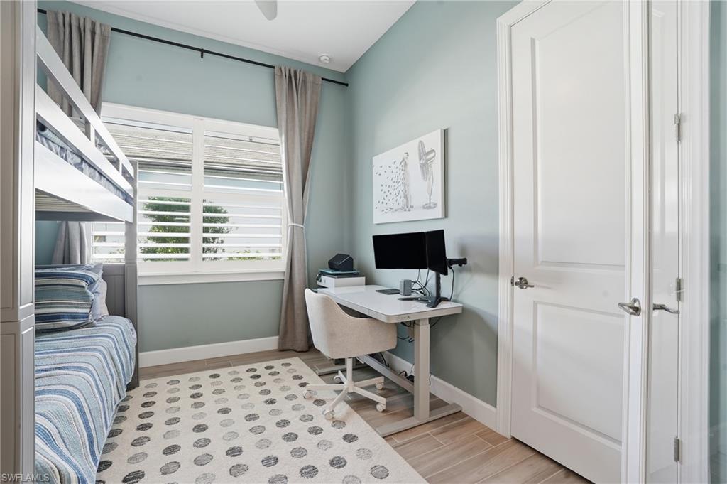 1872 Terreno Boulevard Naples, FL 34120 - Photo 27 of 50 a living room with furniture and a window