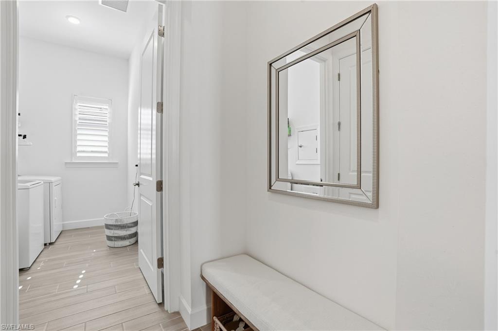 1872 Terreno Boulevard Naples, FL 34120 - Photo 30 of 50 a bathroom with a granite countertop sink a toilet and a window