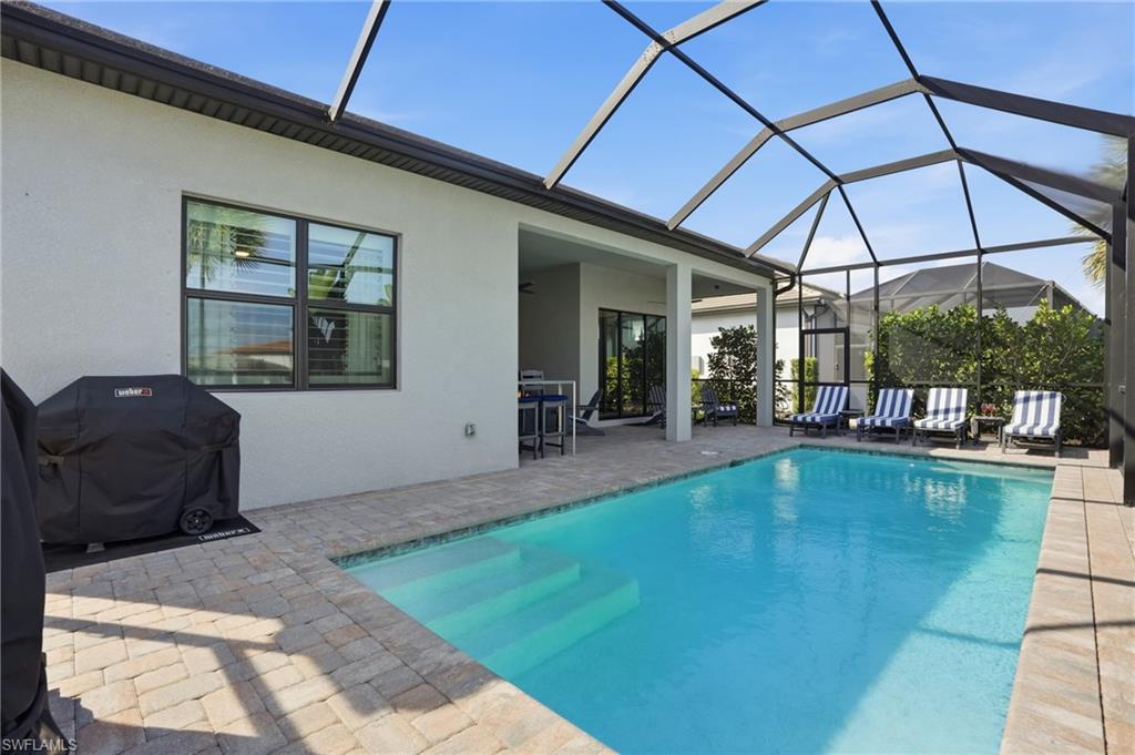 1872 Terreno Boulevard Naples, FL 34120 - Photo 34 of 50 a living room with furniture and large windows