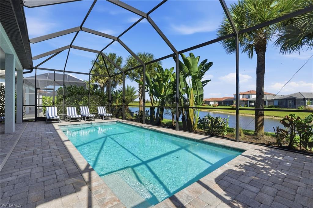 1872 Terreno Boulevard Naples, FL 34120 - Photo 35 of 50 a view of a swimming pool with a patio