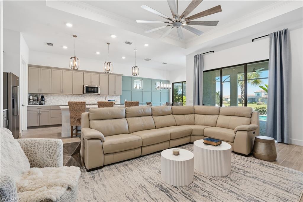 1872 Terreno Boulevard Naples, FL 34120 - Photo 5 of 50 a living room with furniture and a large window