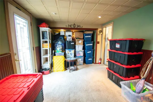 a bed room with a bed and a large window