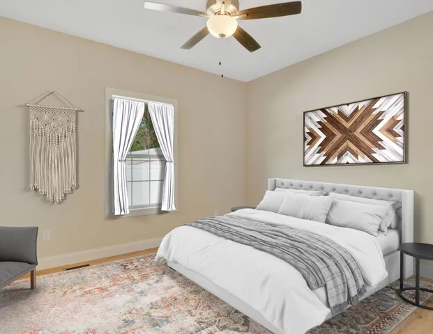 a bedroom with a large bed and a window