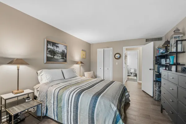 a bedroom with a bed and closet