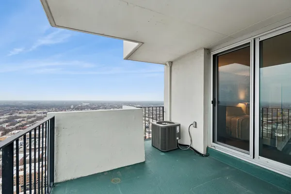 a view of balcony with floor to ceiling window and stairs