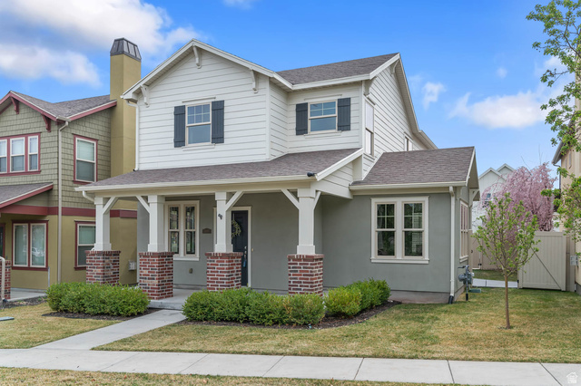 11097 Topview Road South Jordan, UT 84009 - Photo 1 of 1 Craftsman inspired home featuring a porch, a shingled roof, brick siding, a chimney, and stucco siding