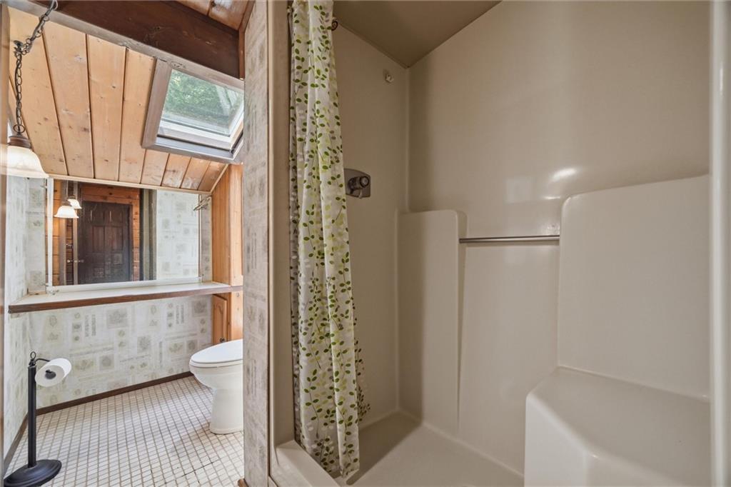 6110 Saltsburg Road Murrysville, PA 15668 - Photo 25 of 47 a bathroom with a shower curtain and a window